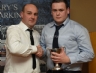 Rasharkin Senior Hurling Manager Paul McFerran presents Aidan McKeever with the McMullan Cup for Most Improved Hurler.